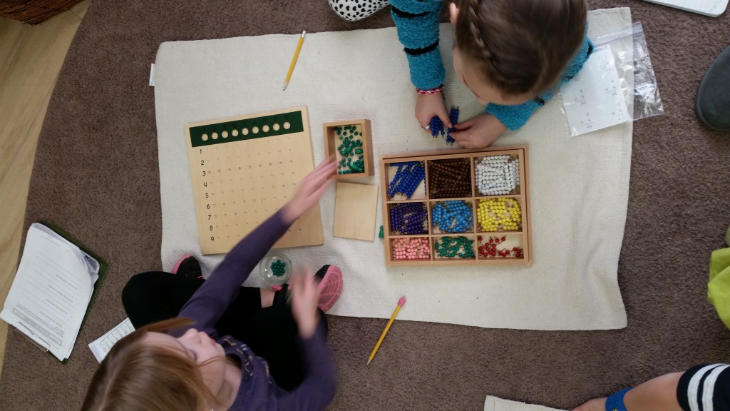 Two students sharing a work mat to complete math activities